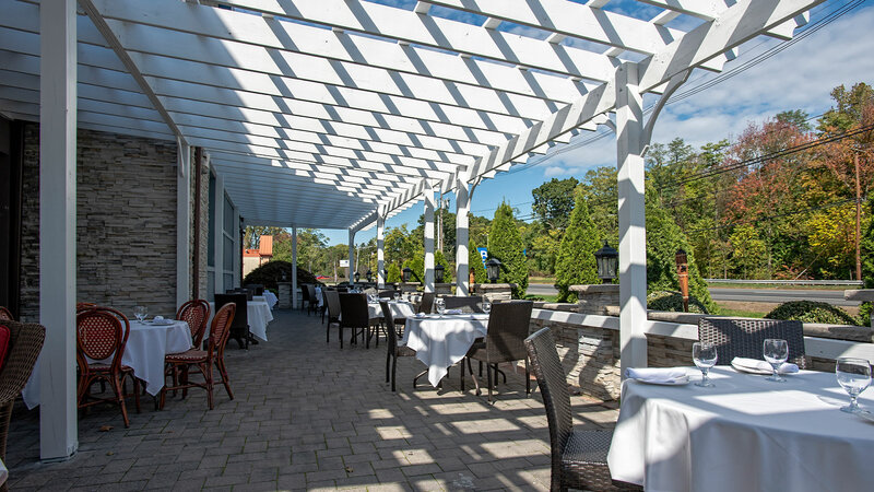 Outside dining area with view of restaurant sign